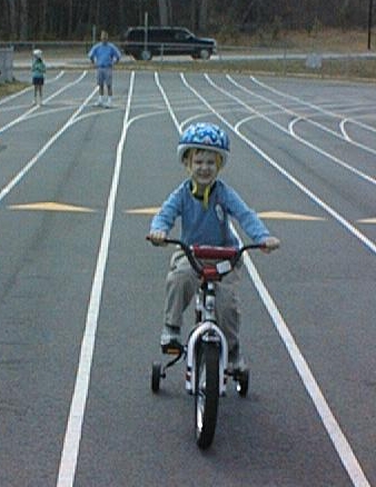 Picture:Bryson riding bike with training wheels