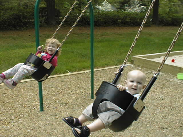 2 kids in swing